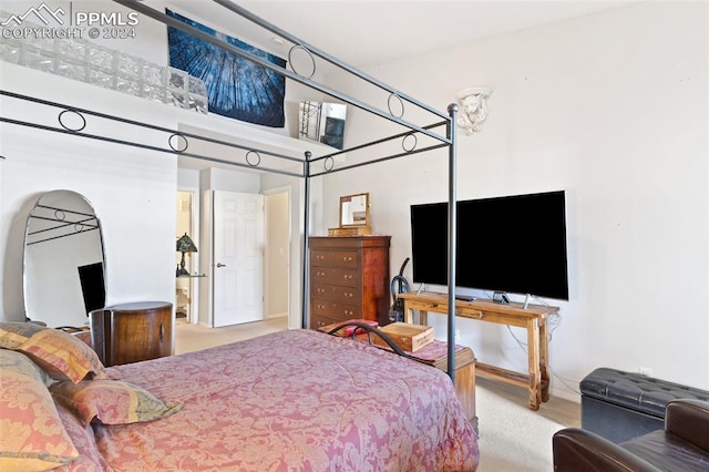 carpeted bedroom featuring a high ceiling