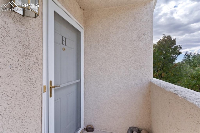 entrance to property with a balcony