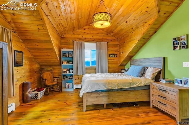 bedroom featuring lofted ceiling, a baseboard radiator, wood ceiling, and light hardwood / wood-style floors