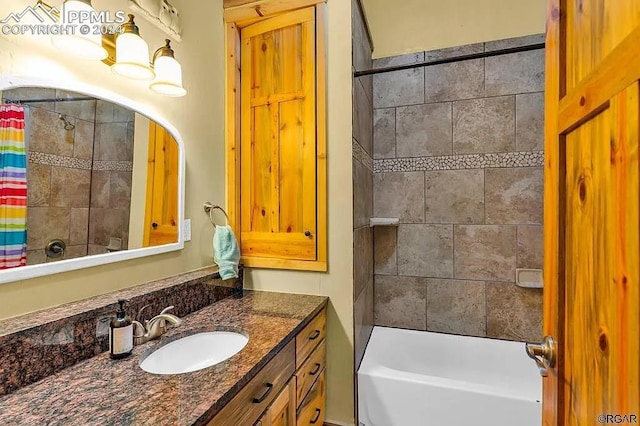 bathroom with shower / bathtub combination with curtain and vanity