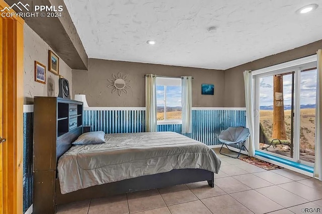 bedroom with light tile patterned floors