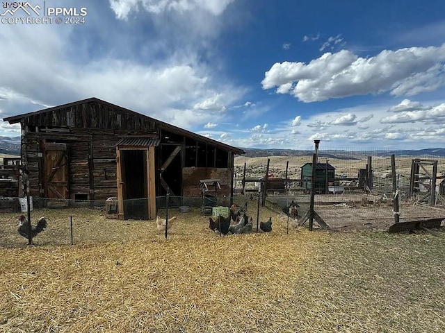 view of outbuilding featuring a rural view