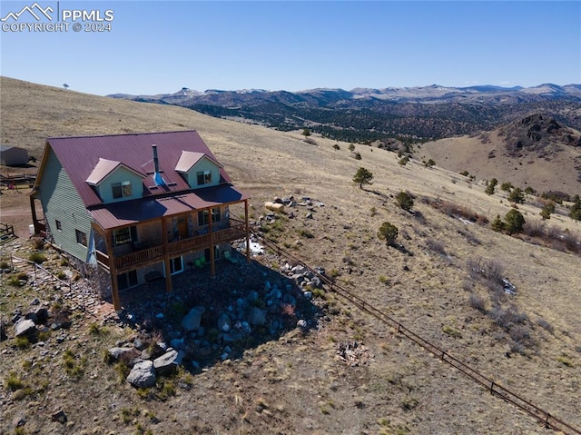 drone / aerial view featuring a mountain view