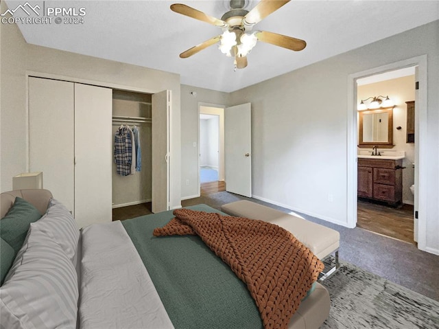 bedroom featuring connected bathroom, carpet, ceiling fan, and sink