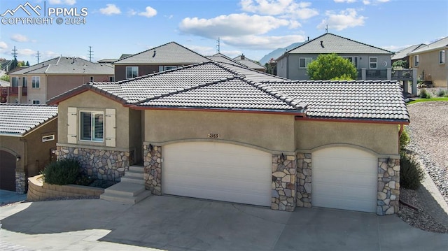 view of front of property with a garage