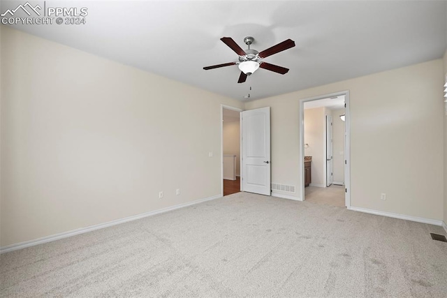 unfurnished bedroom with light carpet and ceiling fan