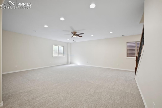 carpeted empty room with ceiling fan