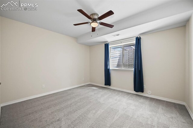 carpeted empty room with ceiling fan