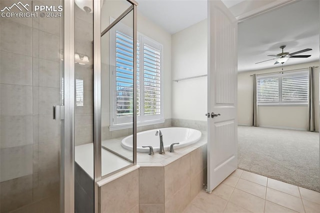 bathroom featuring tile patterned flooring, plus walk in shower, and a wealth of natural light