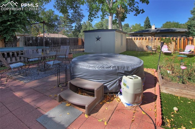 view of patio with a storage shed