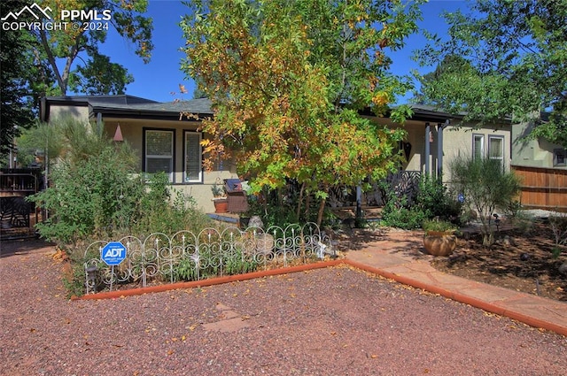 view of property hidden behind natural elements