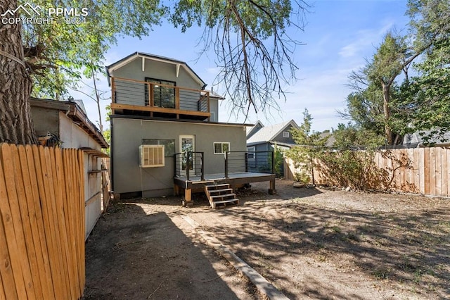 rear view of house featuring a balcony