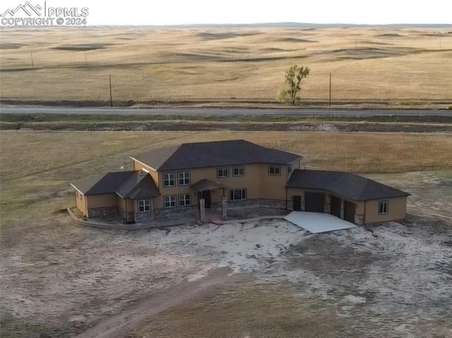 view of front of home featuring a rural view