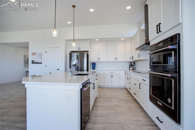 kitchen featuring white cabinets, a kitchen island with sink, light hardwood / wood-style floors, and black appliances