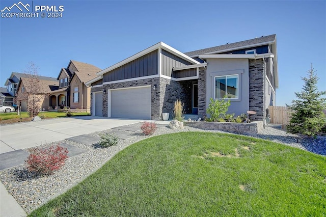 view of front of property with a front lawn and a garage