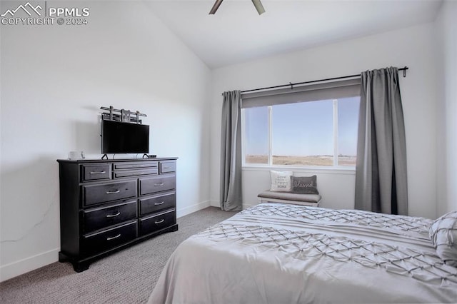 carpeted bedroom with vaulted ceiling and ceiling fan