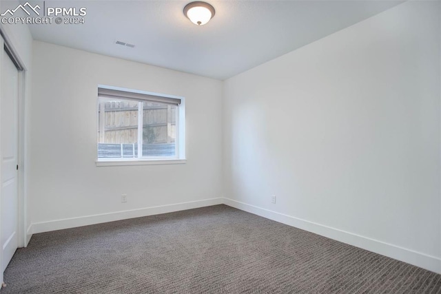 spare room featuring carpet flooring