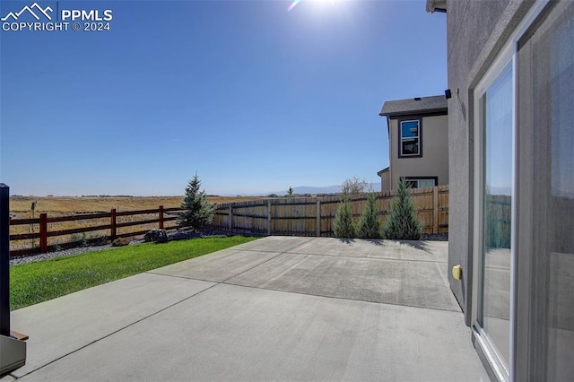 view of patio / terrace featuring a rural view