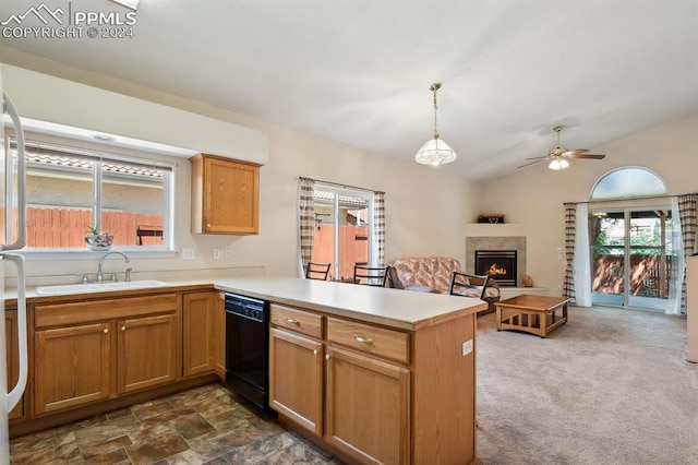 kitchen featuring dark colored carpet, dishwasher, sink, kitchen peninsula, and hanging light fixtures