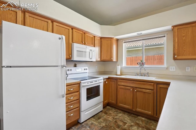 kitchen with white appliances and sink