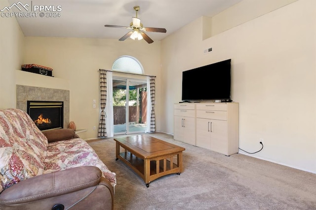 carpeted living room featuring ceiling fan and high vaulted ceiling