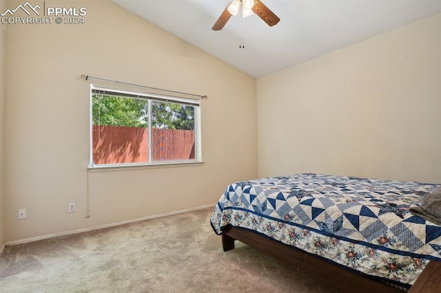 bedroom with ceiling fan, carpet floors, and vaulted ceiling