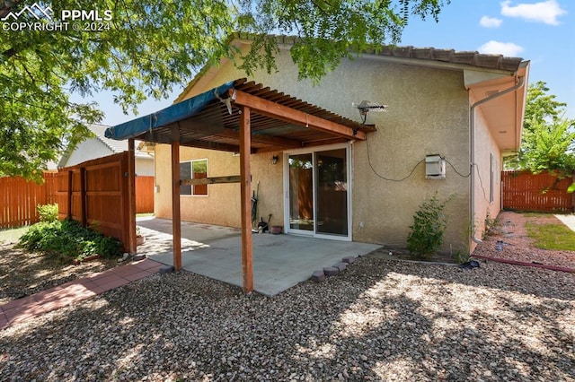 back of property featuring a patio