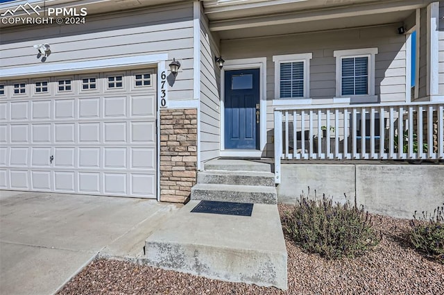 entrance to property featuring a garage