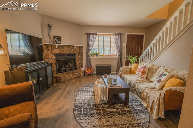 living room featuring hardwood / wood-style flooring and a fireplace