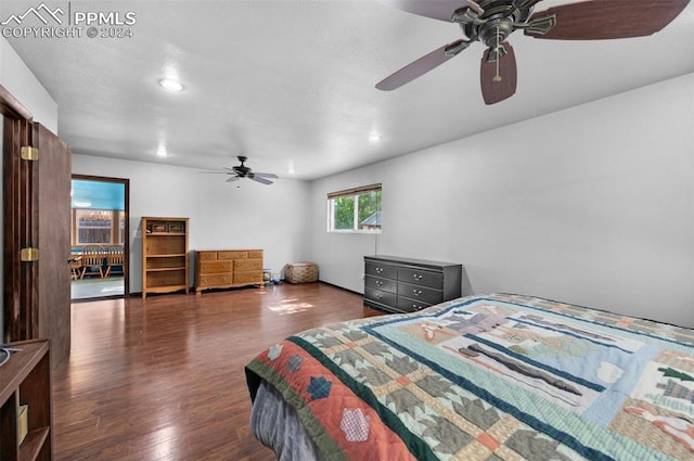 bedroom featuring ceiling fan and dark hardwood / wood-style flooring