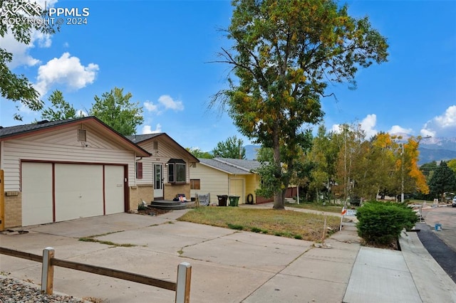 single story home featuring a garage