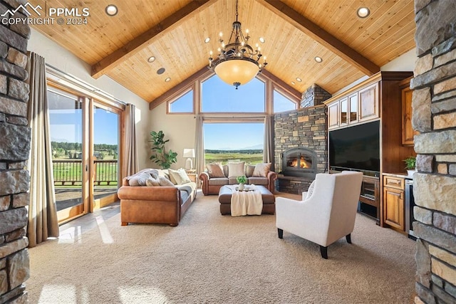 carpeted living room featuring a wealth of natural light, beam ceiling, a stone fireplace, and high vaulted ceiling