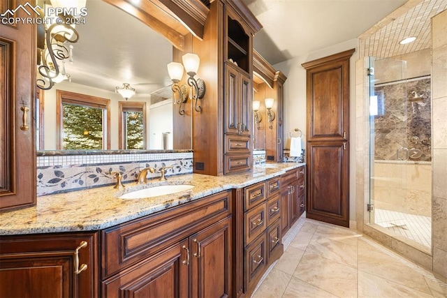 bathroom featuring vanity, decorative backsplash, and walk in shower