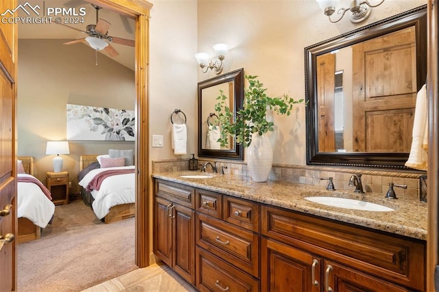 bathroom featuring vanity, vaulted ceiling, backsplash, and ceiling fan