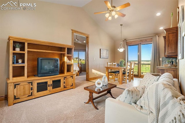 living room with light carpet, high vaulted ceiling, and ceiling fan