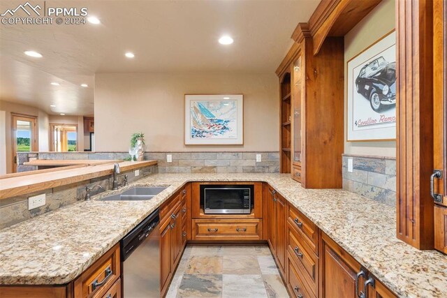 19155 Lochmere Ct, Monument, CO 80132 - kitchen with a sink, built in microwave, brown cabinets, dishwasher, and recessed lighting