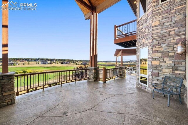 19155 Lochmere Ct, Monument, CO 80132 - view of patio with view of golf course and a balcony