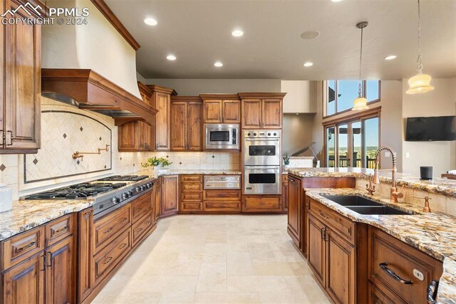 19155 Lochmere Ct, Monument, CO 80132 - kitchen with a sink, a warming drawer, brown cabinets, appliances with stainless steel finishes, and tasteful backsplash