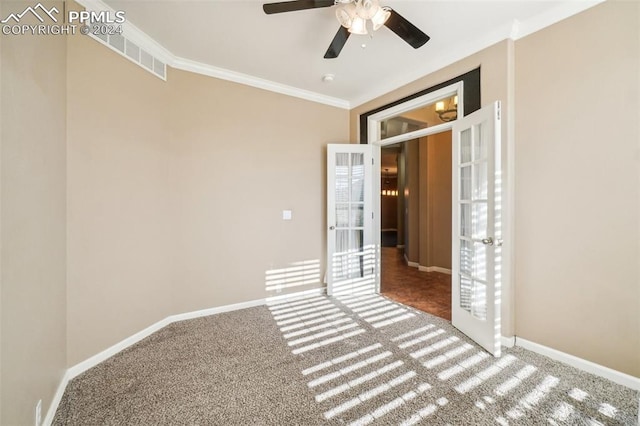 carpeted empty room with ornamental molding and ceiling fan