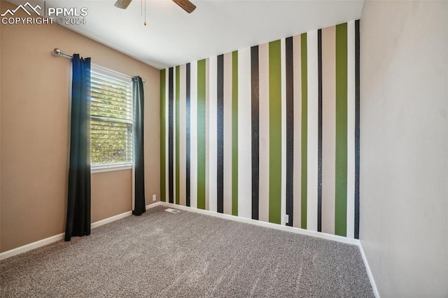 carpeted empty room with ceiling fan