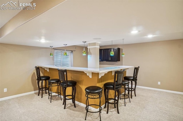 bar featuring pendant lighting and light colored carpet