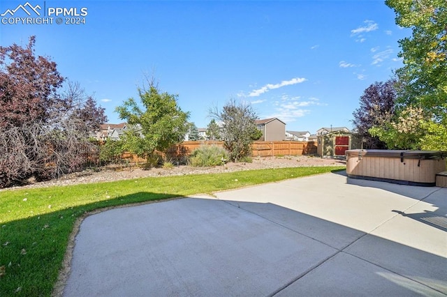 view of patio with a hot tub