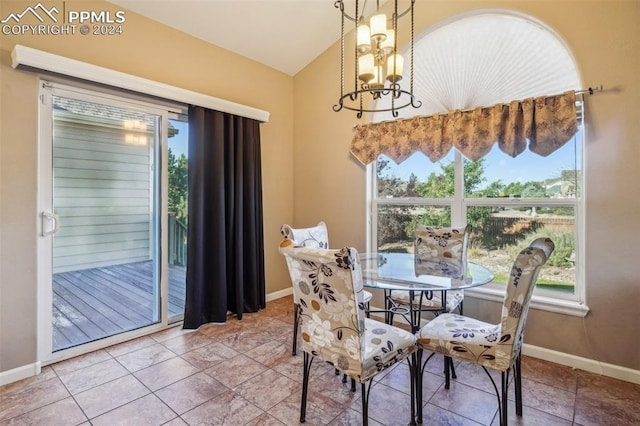 dining area with an inviting chandelier