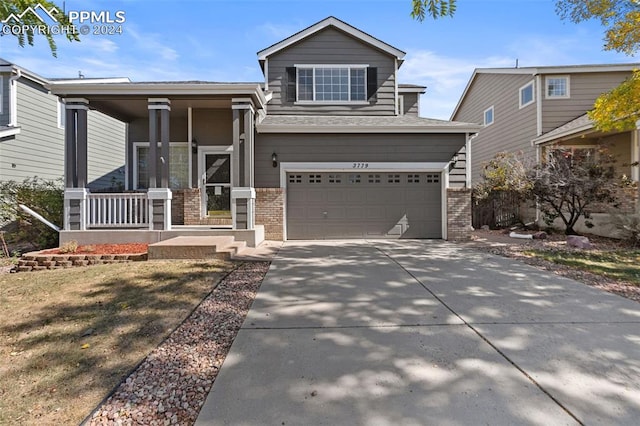 view of front of property featuring a garage and covered porch