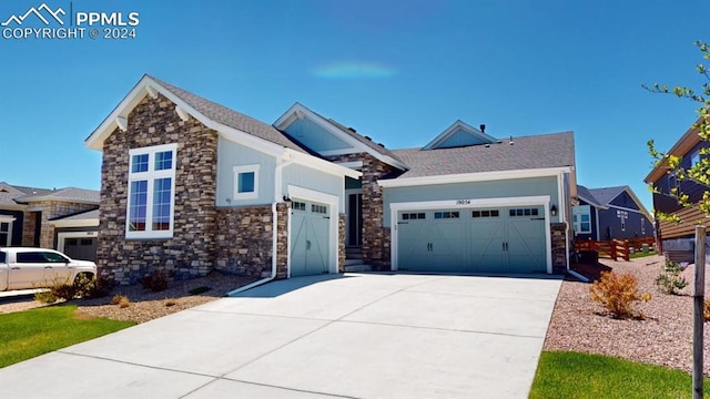 craftsman inspired home with a garage