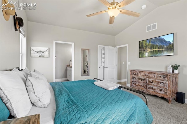 bedroom with carpet, vaulted ceiling, ensuite bathroom, and ceiling fan