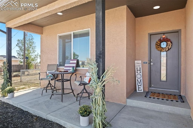 doorway to property featuring a patio