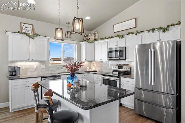 kitchen featuring white cabinets and appliances with stainless steel finishes