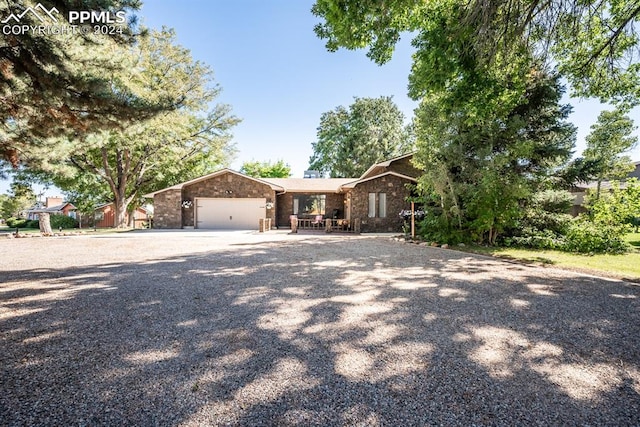 single story home featuring a garage