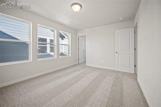 empty room featuring carpet floors